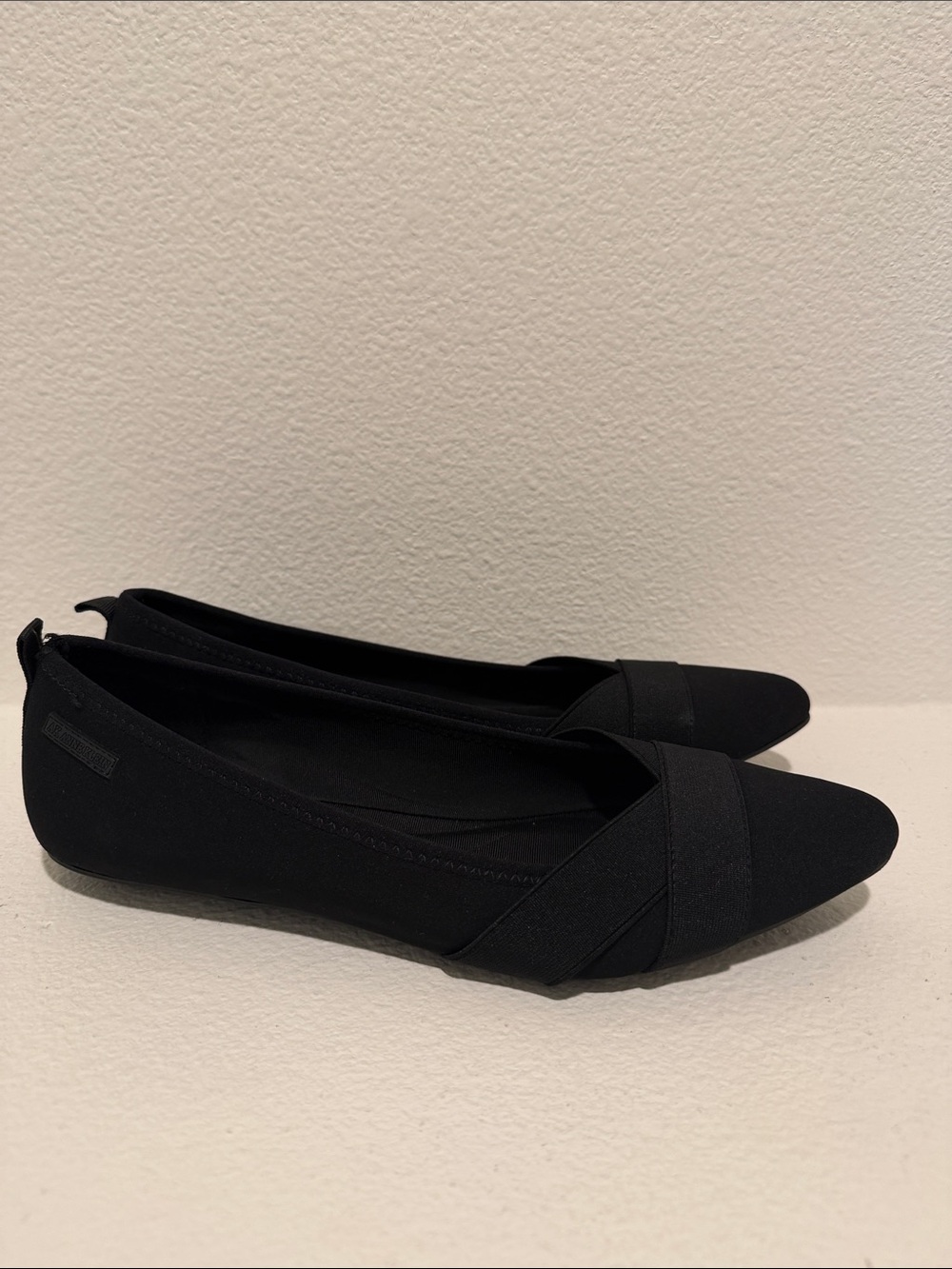 Anne Klein Black Pointed-Toe Slip-On Flats with Crossover Strap